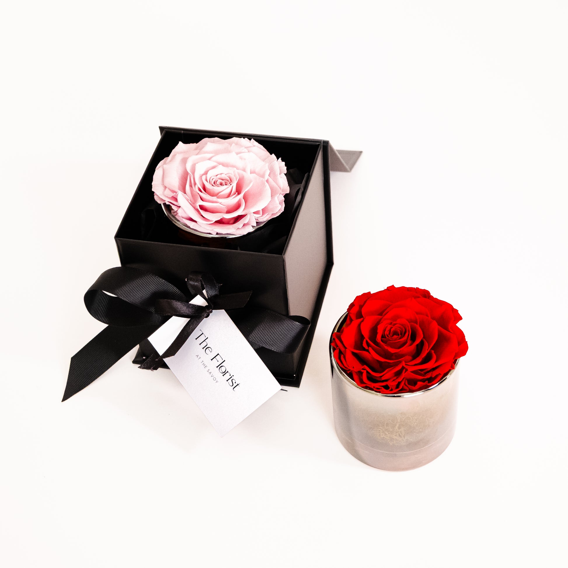 Luxury preserved roses in pink and red, held in an elegant branded Florist at The Savoy box